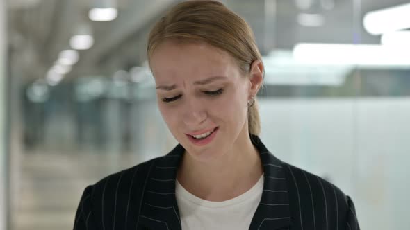 Portrait of Businesswoman Reacting To Loss 