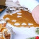 Child cuts heart shaped gingerbread cookie on table, dolly shot - VideoHive Item for Sale