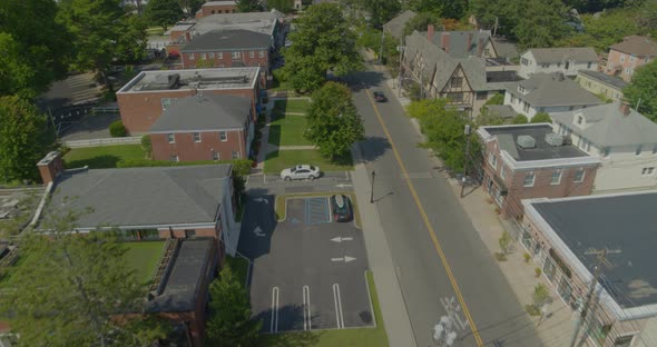 Flying Over the Downtown Area of a Small Town in Long Island