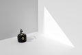 Matte black kettle against white wall. Stylish kettle for heating water to boiling for tea and - PhotoDune Item for Sale
