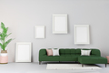 Living room in house with modern interior design, green velvet sofa, plant, carpet, mock up poster - PhotoDune Item for Sale