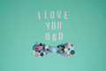 Father's Day poster on a mint background with a bow tie made of buttons - PhotoDune Item for Sale