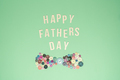 Father's Day poster on a mint background with a bow tie made of buttons - PhotoDune Item for Sale
