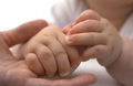 Baby hands holding mothers finger close up - PhotoDune Item for Sale