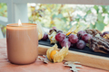 Hello autumn. Cozy fall still life with candle and fruits - PhotoDune Item for Sale