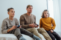 Father and children boys with joysticks playing video games at home - PhotoDune Item for Sale