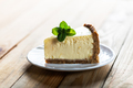 Slice of New York cheesecake with a sprig of mint - PhotoDune Item for Sale