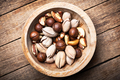 Dried mixed nuts in wooden bowl closeup - PhotoDune Item for Sale