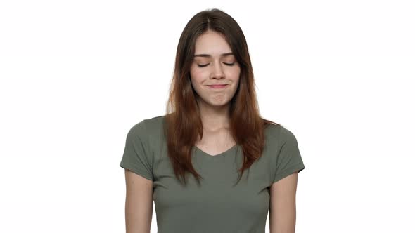 Portrait of Modest Young Woman 20s Shaking Head and Expressing Denial Isolated Over White Background