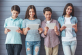 Teenagers with gadgets - PhotoDune Item for Sale