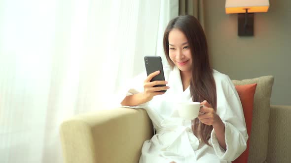 Young asian woman use smart phone