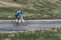 Man riding bicycle on mountain road - PhotoDune Item for Sale