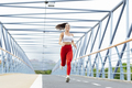 Young woman running outdoors on the bridge - PhotoDune Item for Sale