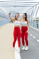 Two sporty women taking a selfie outdoors - PhotoDune Item for Sale