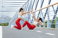 Two happy pretty athlete women doing sport training outdoors - PhotoDune Item for Sale