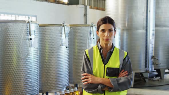 Worker standing with arms crossed