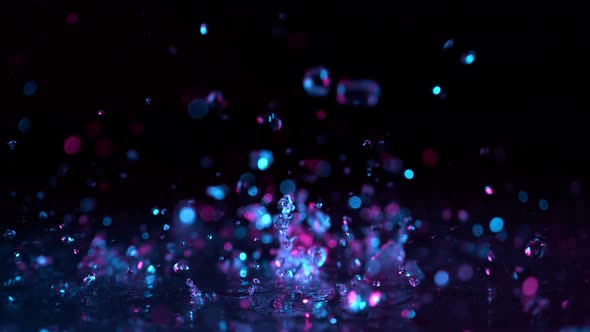 Super Slow Motion Abstract Shot of Splashing Neon Water at 1000Fps.