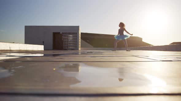 Ballet dancer practicing on rooftop