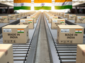 Made in India. Cardboard boxes with text made in India and  indian flag on the roller conveyor. - PhotoDune Item for Sale