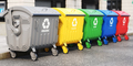 Garbage containers with separated garbage on a street.  - PhotoDune Item for Sale