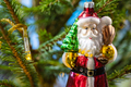 glass santa claus figurine and lamp on xmas tree - PhotoDune Item for Sale