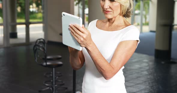Female business executives using digital tablet
