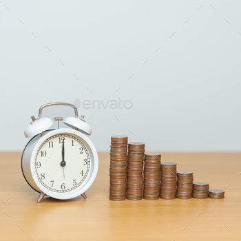sion, Investment, Wealth Business and Financial concepts. coins money stack with clock on table