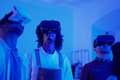 Three friends using virtual reality glasses inside the house - PhotoDune Item for Sale