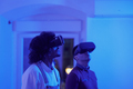 Two friends using vr goggles indoors illuminated with a blue light - PhotoDune Item for Sale