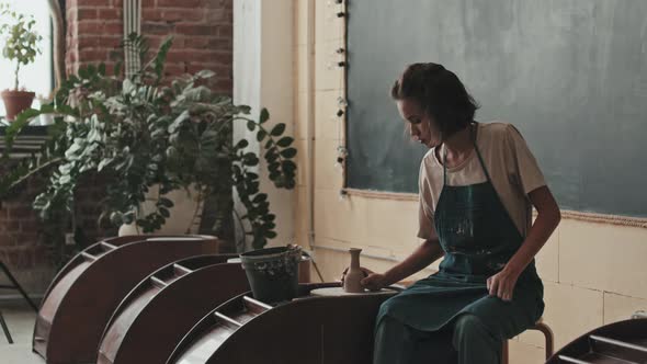 Woman Taking Handmade Vase Away