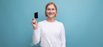 panoramic photo of blonde middle aged woman in white sweater with money card mockup