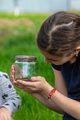 Child in nature with a lizard. Selective focus. - PhotoDune Item for Sale