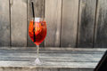 Still life of aperol spritz cocktail on wooden surface - PhotoDune Item for Sale