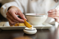 Female is ready to eat a tasty fried potato dipping in a delicate sauce - PhotoDune Item for Sale