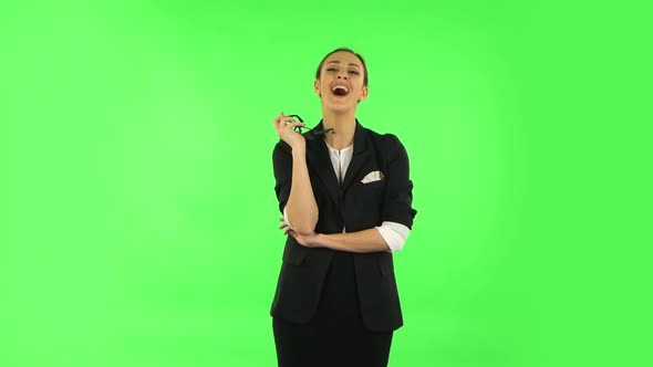 Woman Laughing While Looking at Camera. Green Screen