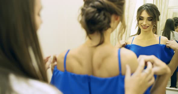 Woman in Dress in Fitting Room