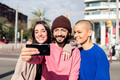 three young friends taking a selfie in the city, - PhotoDune Item for Sale