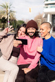 three funny friends taking a selfie in the city - PhotoDune Item for Sale