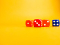 Colored dice on a yellow background. Game play concept. - PhotoDune Item for Sale