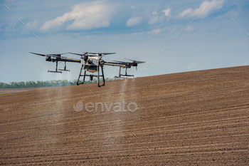 drone sprayer on the background of a plowed field, precision farming, the latest agriculture