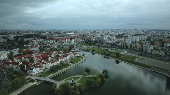 Flight over the city in cloudy weather.