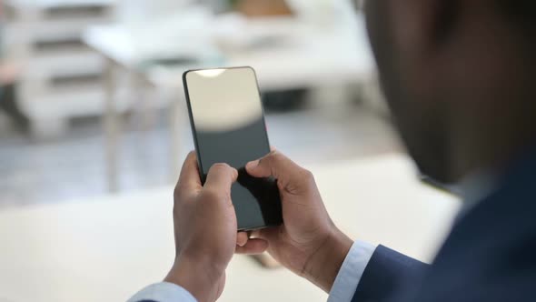 Hands of Businessman Typing on Smartphone Close Up