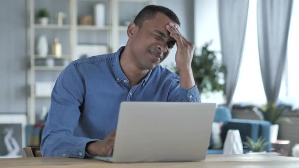 Headache Young African Man in Tension Working in Office Pain