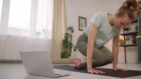 Female Yoga Instructor Showing Pose during Online Class