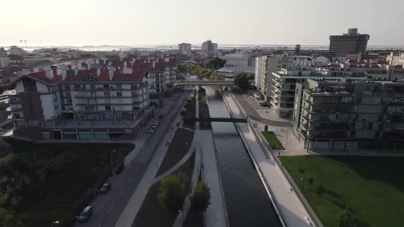 Moliceiro, traditional boat of Ria de Aveiro. Aerial view of Aveiro cityscape and canals.