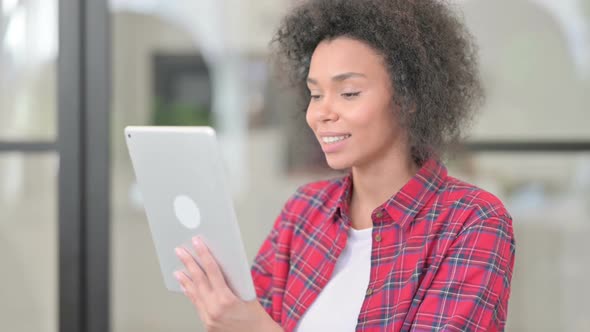 Video Call on Tablet By African Woman