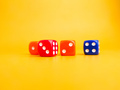Colored dice on a yellow background. Game play concept. - PhotoDune Item for Sale