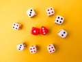 Top view Colored dice on a yellow background. - PhotoDune Item for Sale