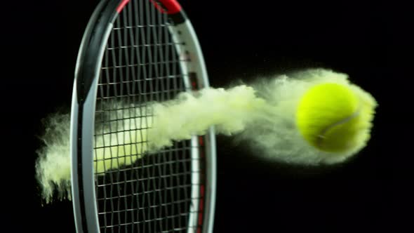 Super Slow Motion Detail Shot of Hitting Tenis Ball Containing Yellow Powder By Racket at 1000 Fps