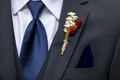 Boutonniere, tie, and handkerchief detail shot on the suit of a groom or groomsman - PhotoDune Item for Sale